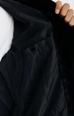 Manteau fausse fourrure à capuche -
